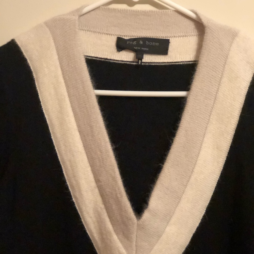 Black V neck dress with cream & tan.